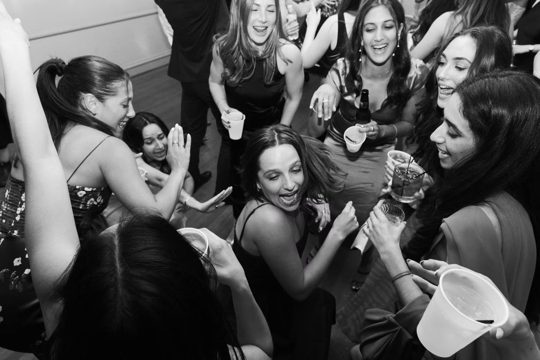 iSecret Records guests dancing and laughing at a wedding reception